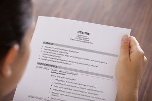 Young Businesswoman Reading Resume